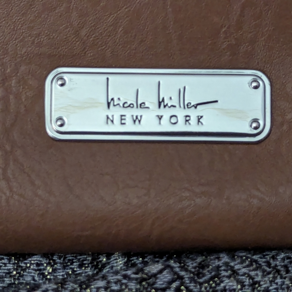 Nicole Miller Crossbody handbag in brown with ivory lining and silver accents